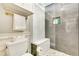 Remodeled bathroom with grey tiled shower, bench, and glass door enclosure at 920 Memorial Se Dr # 35, Atlanta, GA 30316