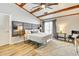 A well-lit primary bedroom features wood beam ceiling and luxury decor at 920 Memorial Se Dr # 35, Atlanta, GA 30316