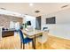 Open living and dining area with hardwood floors, brick accent wall, and natural light at 920 Memorial Se Dr # 35, Atlanta, GA 30316
