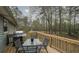 Relax on the home's back deck overlooking the wooded backyard at 1074 Whooping Creek Rd, Carrollton, GA 30116
