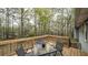 Relax on the home's back deck overlooking the wooded backyard at 1074 Whooping Creek Rd, Carrollton, GA 30116