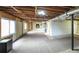 Large unfinished basement with exposed ductwork and lighting at 1074 Whooping Creek Rd, Carrollton, GA 30116