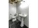 Finished bathroom with toilet, sink and updated floors at 1074 Whooping Creek Rd, Carrollton, GA 30116
