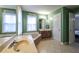 Bathroom featuring a tub, sink, and open doorway leading into another room at 1074 Whooping Creek Rd, Carrollton, GA 30116