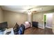 Bedroom featuring a twin bed, dark wood flooring and a desk area in the corner at 1074 Whooping Creek Rd, Carrollton, GA 30116