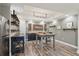 Finished basement features custom shelving, decor, a bar area, and wood-look flooring at 1270 Smokehouse Trl, Cumming, GA 30041