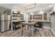 Finished basement features custom shelving, decor, a bar area, and wood-look flooring at 1270 Smokehouse Trl, Cumming, GA 30041