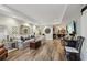 Finished basement with wood flooring, modern lighting, and comfortable seating area at 1270 Smokehouse Trl, Cumming, GA 30041