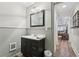 Modern bathroom vanity with a dark cabinet, mirror, and white countertop creates a clean and inviting space at 1270 Smokehouse Trl, Cumming, GA 30041