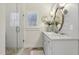Bright bathroom with glass enclosed shower and double vanity with granite countertops at 1270 Smokehouse Trl, Cumming, GA 30041