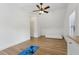 Minimal bedroom with hardwood floors, a yoga mat, and a bright window at 1270 Smokehouse Trl, Cumming, GA 30041