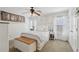 Inviting bedroom with a trunk at the foot of the bed and white furnishings at 1270 Smokehouse Trl, Cumming, GA 30041