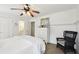 Bright bedroom featuring a white bed set, a dresser, and a rattan chair at 1270 Smokehouse Trl, Cumming, GA 30041