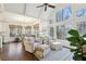 Sun-drenched dining area with large windows, hardwood floors, and a view into the adjacent living area at 1270 Smokehouse Trl, Cumming, GA 30041