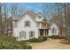 This is a lovely home with a manicured lawn, gray roof, and stone accents at 1270 Smokehouse Trl, Cumming, GA 30041