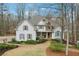 Charming two-story home with a stone accents, well-maintained landscaping, and inviting front porch at 1270 Smokehouse Trl, Cumming, GA 30041