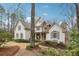 A charming two-story home with a stone accent and a well-manicured lawn at 1270 Smokehouse Trl, Cumming, GA 30041