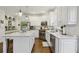 Bright kitchen with white cabinets, stainless steel appliances, and white marble countertops at 1270 Smokehouse Trl, Cumming, GA 30041