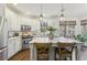 Bright kitchen with white cabinets, stainless steel appliances, and white marble countertops at 1270 Smokehouse Trl, Cumming, GA 30041