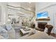 Open-concept living room with fireplace, soaring ceilings, hardwood floors, and view of second-floor balcony at 1270 Smokehouse Trl, Cumming, GA 30041