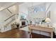 Spacious living room with hardwood floors, stone fireplace, soaring ceilings, staircase and lots of natural light at 1270 Smokehouse Trl, Cumming, GA 30041