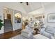 Open concept living space with staircase, built-ins, hardwood floors, and views into the kitchen and dining area at 1270 Smokehouse Trl, Cumming, GA 30041