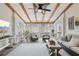 This is a bright sunroom with ceiling fan, comfortable seating, and view of the outdoors at 1270 Smokehouse Trl, Cumming, GA 30041