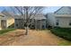 A cozy backyard features green shrubs and a young tree, offering a serene outdoor space at 2675 Sardis Chase Ct, Buford, GA 30519