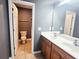Bathroom featuring a double vanity, tile floors and a toilet in a separate room at 2675 Sardis Chase Ct, Buford, GA 30519
