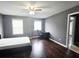 Bedroom featuring a large window, hard wood floors and a dark grey paint at 2675 Sardis Chase Ct, Buford, GA 30519