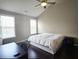 Bright bedroom with vaulted ceilings, hardwood floors, and two windows at 2675 Sardis Chase Ct, Buford, GA 30519