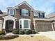 Stunning two-story home with stone accents, lush landscaping and a two car garage at 2675 Sardis Chase Ct, Buford, GA 30519
