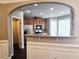 This kitchen features an open layout, stainless appliances, wood cabinets, and stylish backsplash at 2675 Sardis Chase Ct, Buford, GA 30519