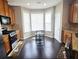 Eat-in kitchen featuring stainless steel appliances, granite countertops and wood floors at 2675 Sardis Chase Ct, Buford, GA 30519