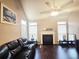 Bright living room features a fireplace, hardwood floors, with natural light streaming through the windows at 2675 Sardis Chase Ct, Buford, GA 30519