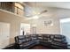 Open-concept living room boasts a cathedral ceiling, a fan and a comfortable, sectional sofa at 2675 Sardis Chase Ct, Buford, GA 30519