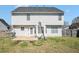 View of the home's backyard, showcasing a well-maintained lawn and a full basketball court at 3287 Shady Valley Ln, Loganville, GA 30052