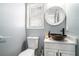 Cozy bathroom features a vessel sink, a decorative mirror and fresh modern touches at 3287 Shady Valley Ln, Loganville, GA 30052