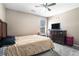 Cozy bedroom featuring neutral walls, carpet, and a window; ceiling fan overhead for comfort at 3287 Shady Valley Ln, Loganville, GA 30052