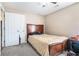 Bedroom features neutral walls, carpet, and a wooden bed frame, offering a peaceful retreat at 3287 Shady Valley Ln, Loganville, GA 30052