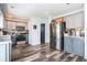 Modern kitchen features sleek stainless steel appliances, stylish gray cabinetry, and hardwood floors at 3287 Shady Valley Ln, Loganville, GA 30052