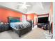 Spacious main bedroom features a tray ceiling, large window and ample space for relaxation at 3287 Shady Valley Ln, Loganville, GA 30052