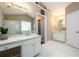 Bright bathroom features a glass enclosed shower and double sinks at 4015 Embassy Way, Lilburn, GA 30047