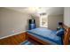Cozy bedroom featuring natural light and neutral tones at 4015 Embassy Way, Lilburn, GA 30047