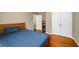 Bedroom with wood floors and a calming blue bedspread at 4015 Embassy Way, Lilburn, GA 30047