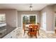 Sunny breakfast area with a sliding glass door and tiled floors at 4015 Embassy Way, Lilburn, GA 30047