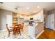Spacious kitchen with breakfast area, white cabinets, and a bar counter at 4015 Embassy Way, Lilburn, GA 30047