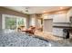 Bright kitchen with granite counters, white cabinets, and an eat-in dining area at 4015 Embassy Way, Lilburn, GA 30047