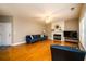 Inviting living room with hardwood floors, fireplace, and neutral color palette at 4015 Embassy Way, Lilburn, GA 30047