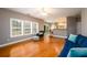 Bright living room boasts hardwood floors, lots of natural light, and an open floor plan at 4015 Embassy Way, Lilburn, GA 30047